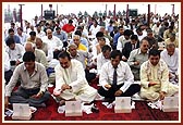 Devotees participating in Maha-puja