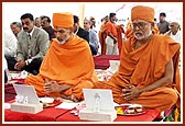 Senior sadhus and devotees participating in maha-puja