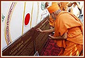 Performing pujan of stone plaque  