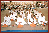 Parshads performing rituals for the saffron diksha ceremony