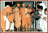 Sadhus and youths greet Swamishri on his 80th birthday at the APC