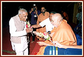  Swamishri honors and blesses senior citizens at a special evening function in Swaminarayan Nagar