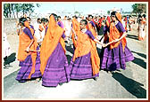 The colorful procession had troupes of tribal youths and teenage girls dancing and singing excitedly 