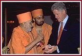 Pramukh Swami Maharaj presents a rosary to the President