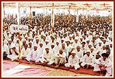 An audience of 8000 people seated in the dedication assembly, with the home owners seated at the front