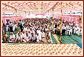 Over 1,000 villagers and guests seated in the public assembly