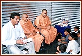 BAPS sadhus give inspiration to pupils attending the school in the BAPS tin-tent city in Bhuj