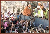 Essentials being distributed by volunteers and sadhus