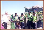 Essentials being distributed by volunteers and sadhus in various villages