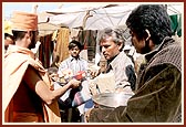 Essentials being distributed by volunteers and sadhus at BAPS Base Camp at Bhuj 