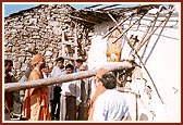 Sadhus and volunteers surveying the calamities