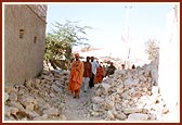 Sadhus and volunteers surveying the calamities