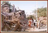 Sadhus and volunteers surveying the calamities