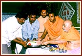 Swamishri presents the foundation bricks to leaders of the villages