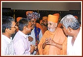 Without any distinctions of great or small, Swamishri meets some of the earthquake victims with the same intimacy and enthusiasm