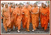 Swamishri surveys the Mandir complex, including the main Gate, the day before the murti-pratishtha