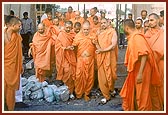 Swamishri surveys the Mandir complex, including the main Gate, the day before the murti-pratishtha