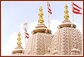 The ornately carved Shikhars increase the grandeur of the mandir