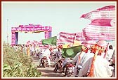 The procession moves through the villages on foot and on vehicles