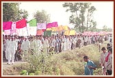 The procession moves through the villages on foot and on vehicles