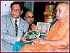 Rotary International District Governor, Shri Kumar Keralramani  presents award to Pramukh Swami Maharaj
