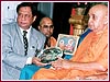 Rotary International District Governor, Shri Kumar Keralramani presents award to Pramukh Swami Maharaj
