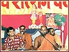 Sadhus and youths singing devotional bhajans
