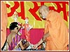 Swamishri lights the divo to inaugurate the convention