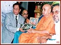 Rotary International District Governor, Shri Kumar Keralramani  presents award to Pramukh Swami Maharaj