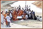 Swamishri is informed about the plans regarding the construction from the ground level