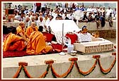 The rituals for the stone-laying ceremony commence before Harikrishna Maharaj on the plinth of Akshardham