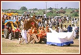 Thakorji was paraded for darshan in a colorful, devotional procession of 40 tractors and floats through the streets and outskirts of Sarangpur village