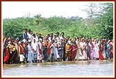 Devotees eagerly engaged in the divine darshan