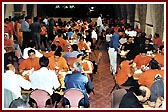 Deligates enjoy a meal in the dining hall