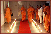 Swamishri emerges from his room and warmly greets the sadhus and devotees with folded hands and affectionate Jai Swaminarayan