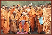 Swamishri patiently listens to details of the complex renovation plans and offers his guidance in the dusty environment