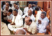 Sadhus and devotees are engaged in singing thals