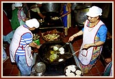 Ladies preparing food items to be offered in the Annakut