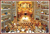 Annakut offered in the central shrine. Display decoratively arranged in a replica of Dada Khachar's Darbar