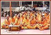 Sadhus sing bhajans during puja