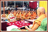 Sadhus sing bhajans during puja