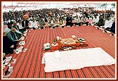 Devotees engaged in Guru Pujan ceremony on stage