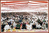 Devotees perform Guru Pujan ceremony in the assembly hall