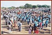 School children dance their way along during the procession