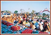 Swamishri performs pujan of the 450,000 mantra books at the specially designed vedika (podium) in the 'Swaminarayan Nagar"