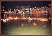 Lighted divas arranged to display the letters of the Swaminarayan mahamantra