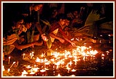 Citizens of Amdavad place lighted diva to honor waters of Narmada