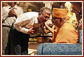 After the assembly Swamishri consoles and blesses relatives of the deceased victims inside the main monument