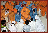 After the assembly Swamishri consoles and blesses relatives of the deceased victims inside the main monument