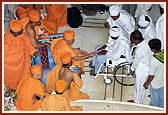 After the assembly Swamishri consoles and blesses relatives of the deceased victims inside the main monument